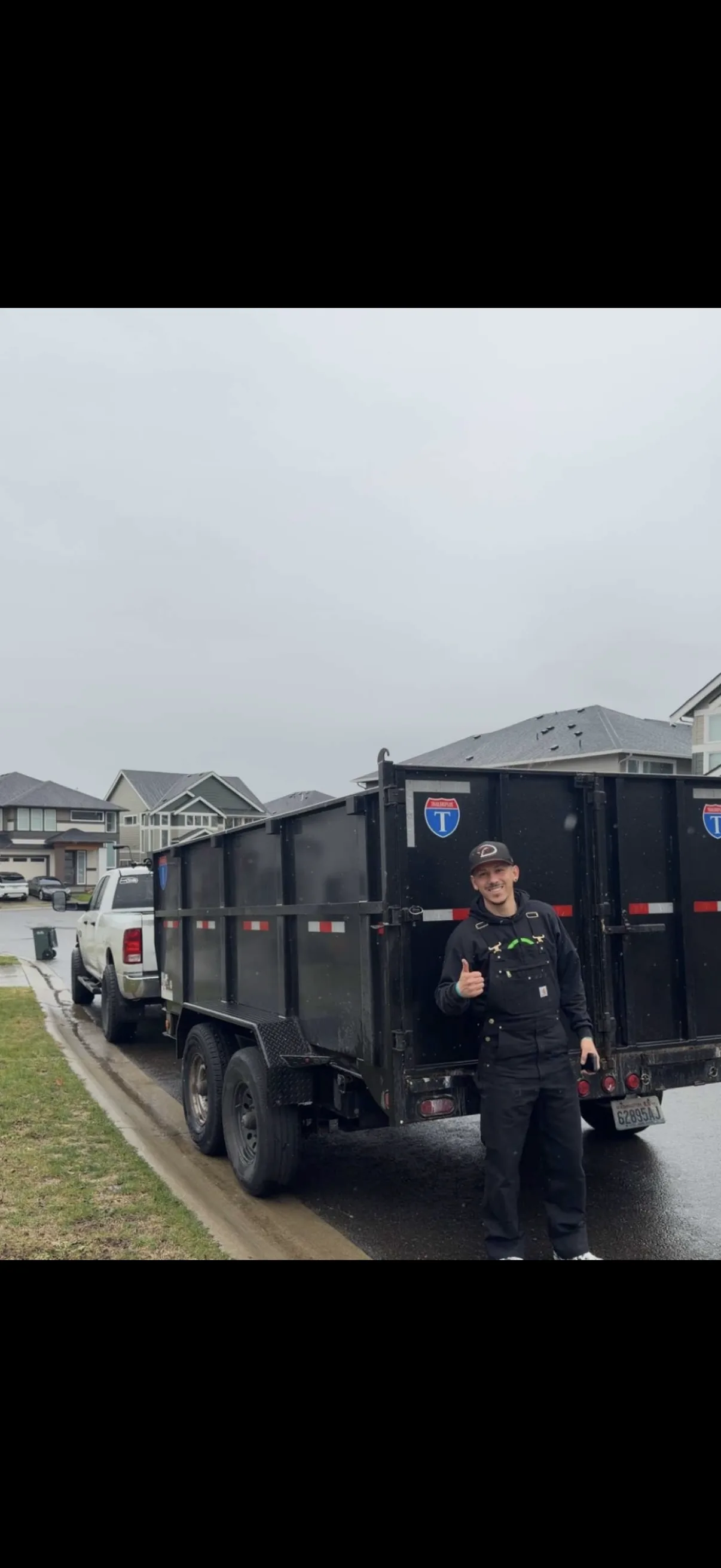 Top Tier crew standing beside trailer on a residential street